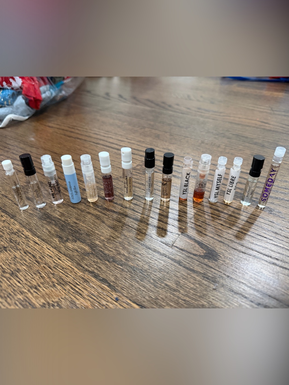 Assorted perfume samples including Dolce & Gabbana, Jo Malone, YSL, Nest